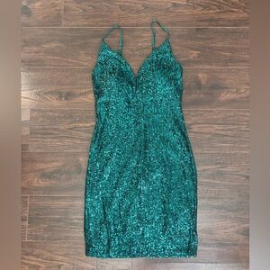 Emerald green sequins body-con mini dress 
Brand new, never worn 
Lined